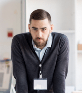 serious-office-worker-looking-at-camera-86QF37A.png